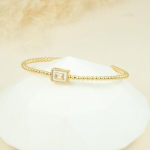 Brazalete de cubo dorado