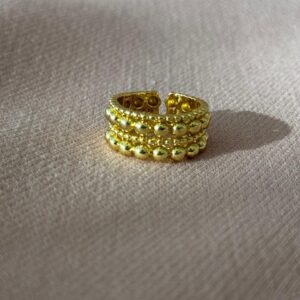 Anillo ajustable de balines de cuatro líneas dorado